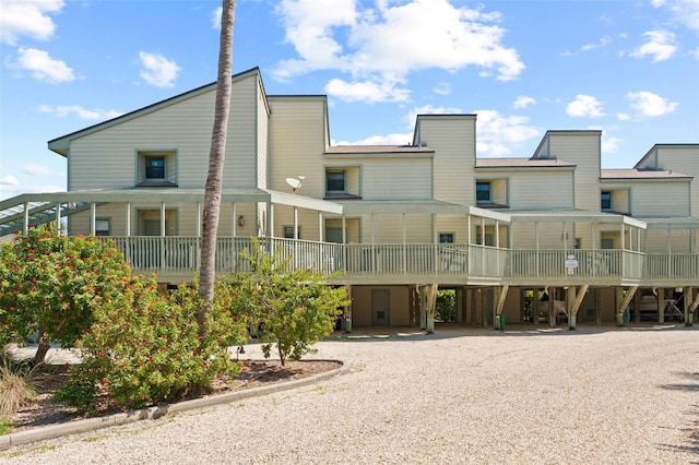 rear view of property featuring a deck