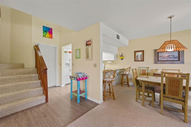 dining space featuring hardwood / wood-style flooring