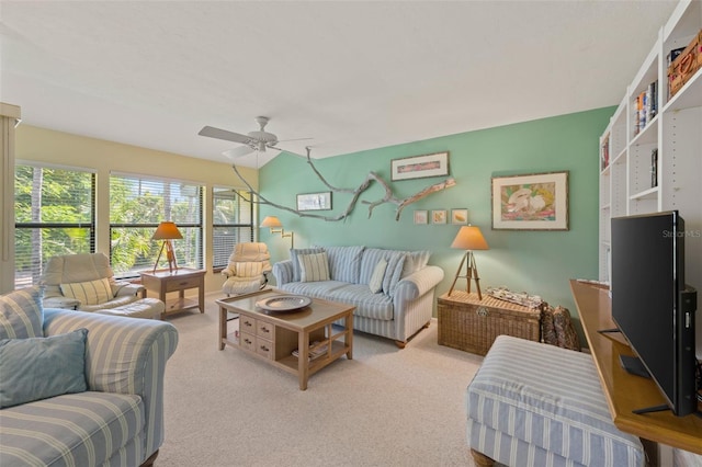 carpeted living room featuring ceiling fan