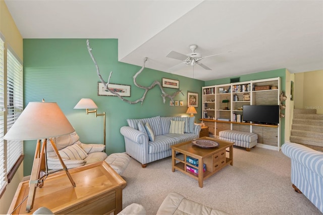 living room featuring ceiling fan and carpet floors