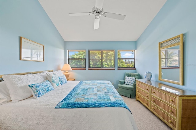 carpeted bedroom featuring vaulted ceiling and ceiling fan