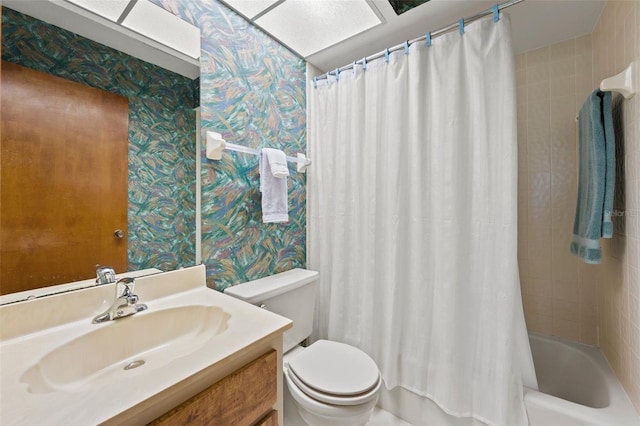 full bathroom with toilet, shower / tub combo with curtain, and vanity