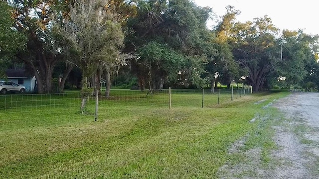 surrounding community featuring a rural view and a yard