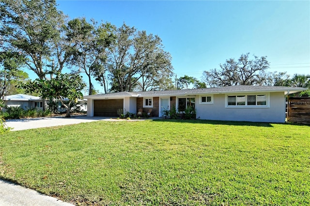 single story home with a front yard and a garage