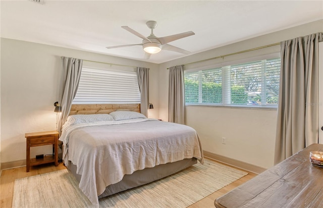 bedroom featuring ceiling fan and light wood-type flooring