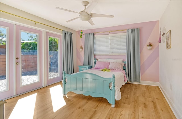 bedroom with access to outside, ceiling fan, and light hardwood / wood-style floors