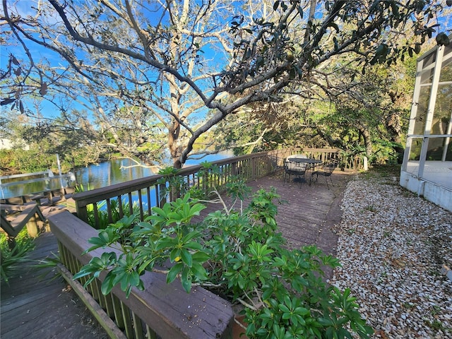 wooden terrace with a water view