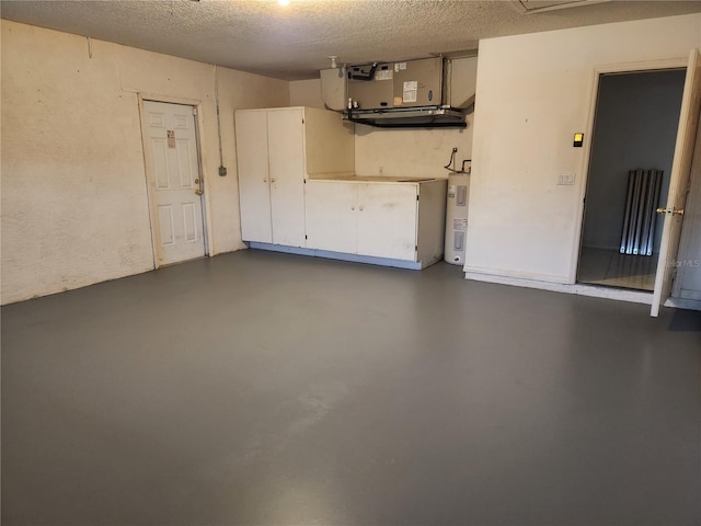 garage featuring heating unit and water heater