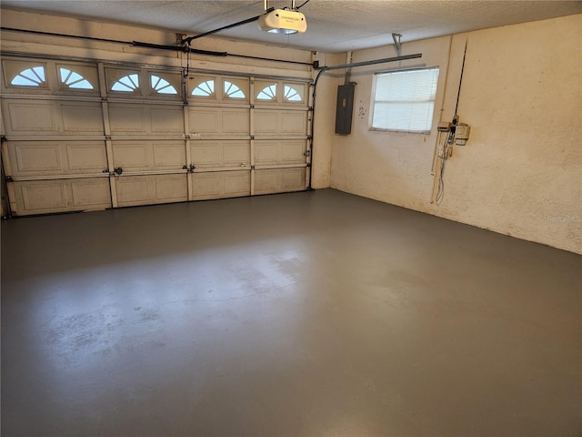 garage featuring a garage door opener and electric panel