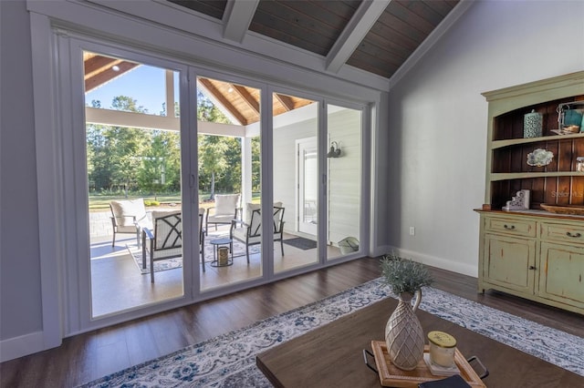 doorway to outside with vaulted ceiling with beams, wood ceiling, and hardwood / wood-style floors