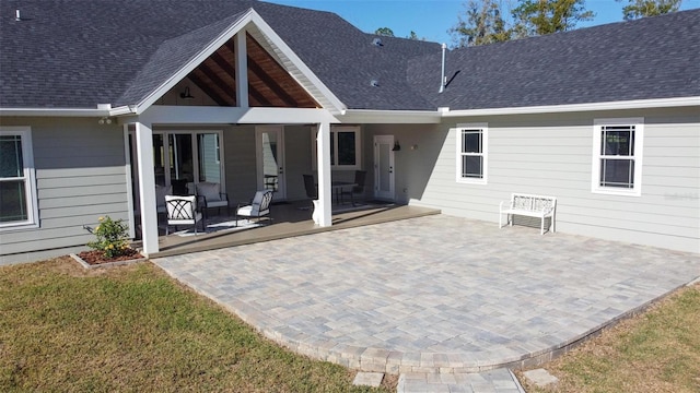 rear view of house featuring an outdoor hangout area, a yard, and a patio area