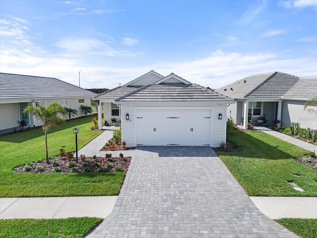 ranch-style house featuring a garage and a front yard