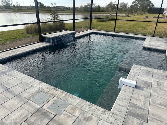 view of swimming pool featuring a yard, pool water feature, and a water view