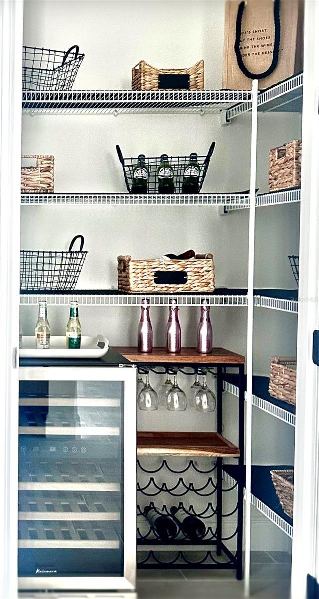 pantry featuring wine cooler