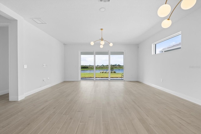 unfurnished room with light hardwood / wood-style flooring