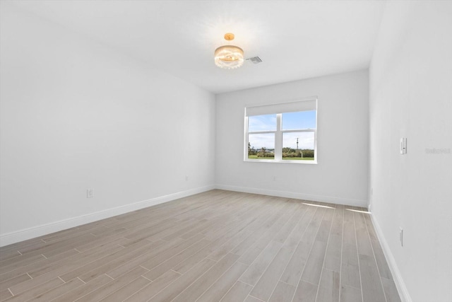 unfurnished room featuring light wood-type flooring