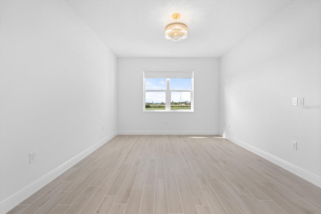 unfurnished room featuring light hardwood / wood-style flooring