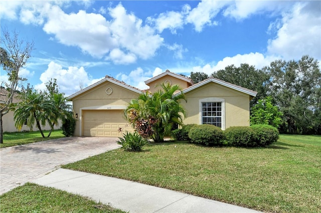 view of front of property with a front lawn and a garage