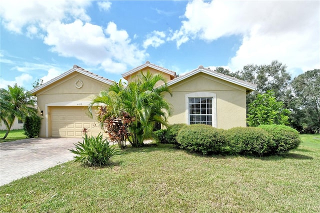 view of front of house with a front lawn and a garage