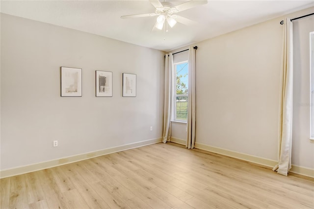 empty room with light wood-type flooring and ceiling fan