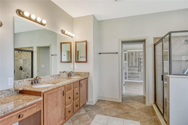 bathroom featuring vanity, tile patterned flooring, and an enclosed shower