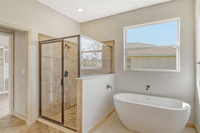 bathroom featuring independent shower and bath and tile patterned floors