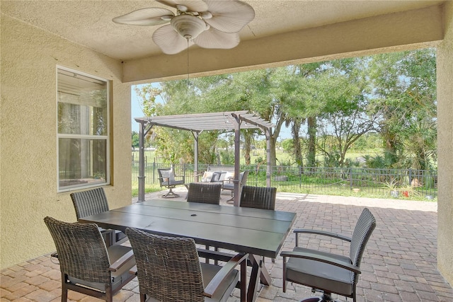 view of patio / terrace with a pergola, ceiling fan, and outdoor lounge area