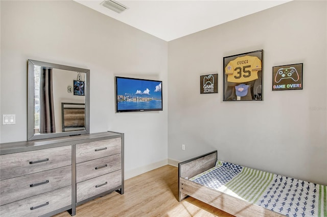 bedroom with light hardwood / wood-style floors