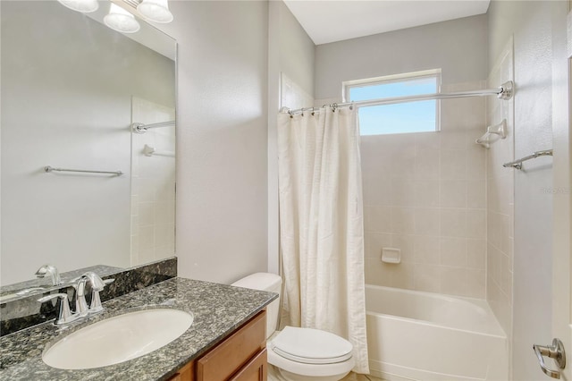 full bathroom featuring toilet, vanity, and shower / tub combo