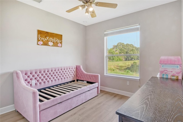 bedroom featuring light hardwood / wood-style floors and ceiling fan