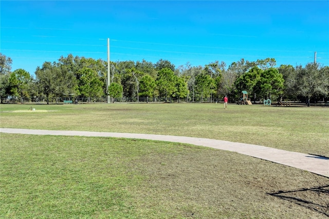 view of property's community with a yard