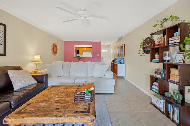 tiled living room with ceiling fan and ornamental molding