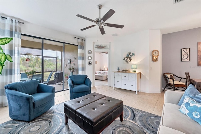 living room with ceiling fan and light tile patterned floors