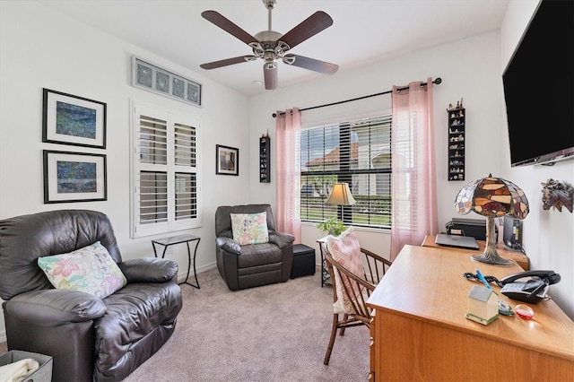 home office featuring ceiling fan and light colored carpet