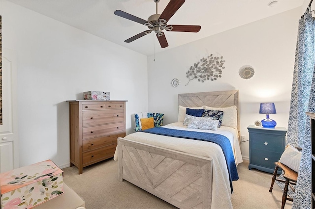 bedroom with ceiling fan and light colored carpet