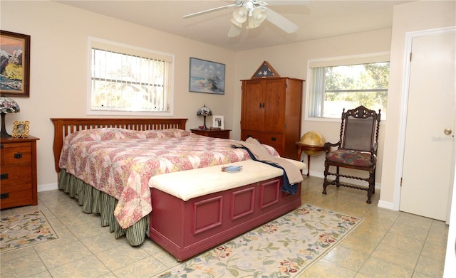 bedroom featuring ceiling fan and light tile patterned floors