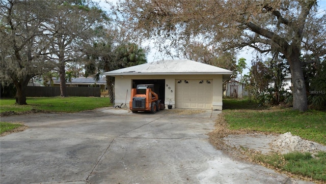 garage featuring a yard