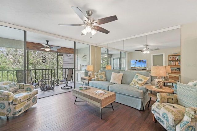 living room featuring ceiling fan, dark hardwood / wood-style floors, a healthy amount of sunlight, and floor to ceiling windows