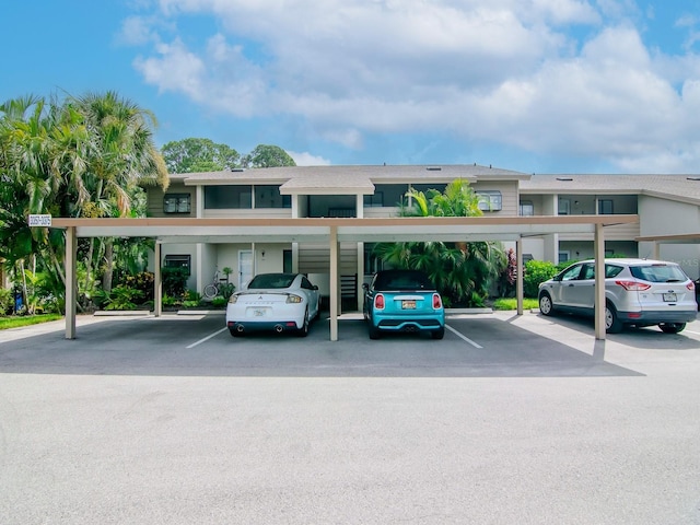 view of parking / parking lot with a carport