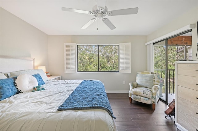 bedroom with dark hardwood / wood-style floors, ceiling fan, multiple windows, and access to outside