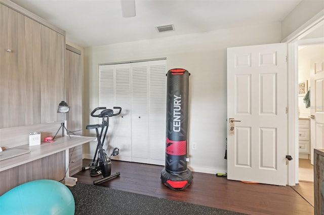 workout area with dark hardwood / wood-style flooring