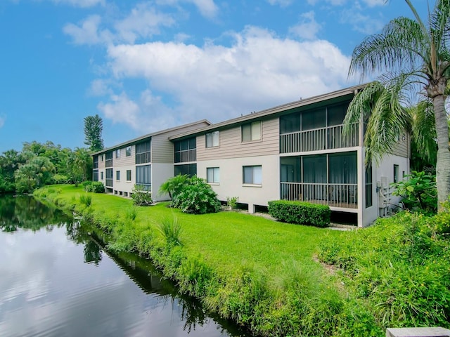 view of building exterior with a water view