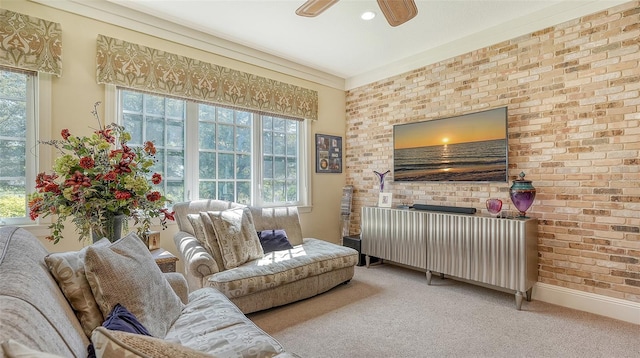 carpeted living room with brick wall, radiator, plenty of natural light, and ceiling fan