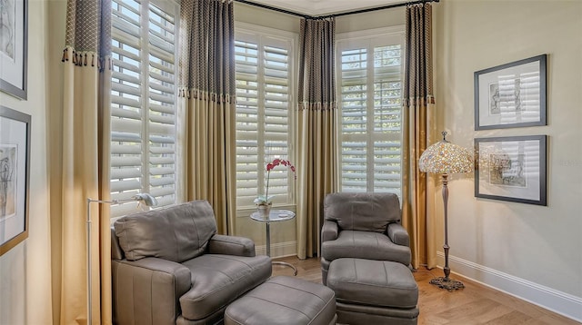 living area with hardwood / wood-style flooring