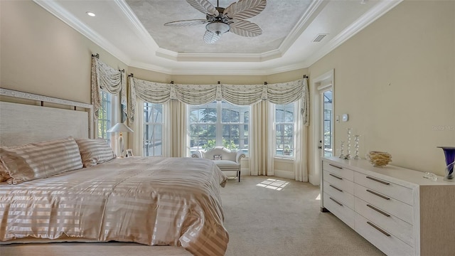 unfurnished bedroom with a raised ceiling, ceiling fan, crown molding, and light carpet