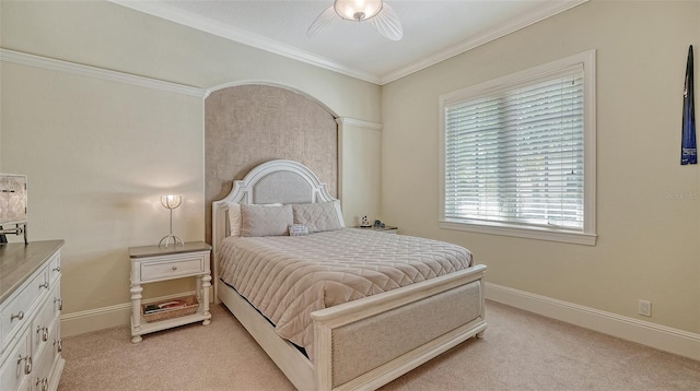 bedroom with ceiling fan, light colored carpet, and ornamental molding