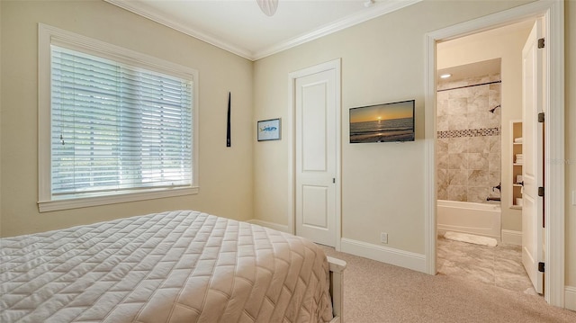 bedroom featuring ornamental molding, light carpet, and connected bathroom