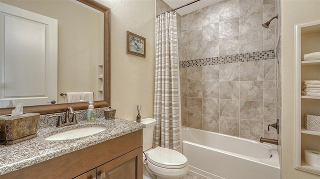 full bathroom featuring shower / bath combination with curtain, toilet, and vanity