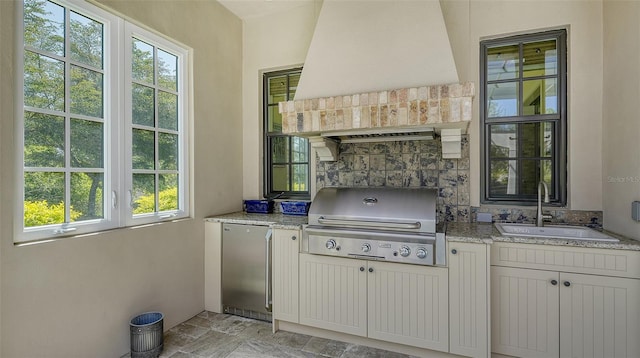 view of patio / terrace featuring area for grilling and sink