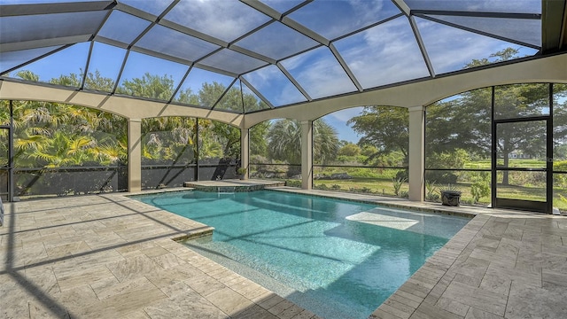 view of swimming pool featuring an in ground hot tub and a patio